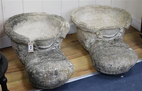 A pair of moulded concrete planters formed as boots W.48cm approx.